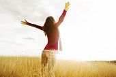 image of health  - Young girl spreading hands with joy and inspiration facing the sun - JPG 