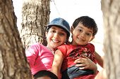 picture of family  - Children in scout camp playing on tree - JPG 