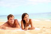 pic of nature  - Couple on beach looking happy during summer travel vacation holidays - JPG 