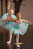 stock photo of steady  - Two ballet students in fancy dresses posing together - JPG 