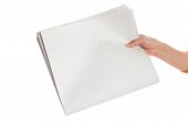 stock photo of newspaper  - Hand holding a Blank Newspaper with white background - JPG 