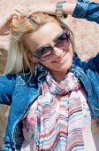 stock photo of watch  - Beautiful blonde with jeans jacket - JPG 