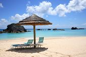 stock photo of bermuda  - empty beach chairs look out over the crystal blue - JPG 