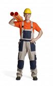 foto of construction worker  - Plumber holding two plastic orange tubes - JPG 