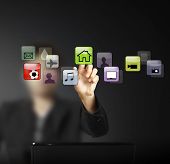 foto of future technology  - hand pushing on a touch screen interface - JPG 