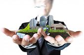 picture of buildings  - person holding a business - JPG 