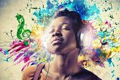 pic of black  - Black girl listening to the music with a pair of headphones - JPG 