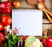 pic of health  - Fresh Organic Vegetables and Spices on a Wooden Background and Paper for Notes - JPG 