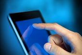 pic of man  - Man hand touching screen on modern digital tablet pc - JPG 