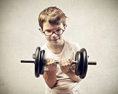 image of dumbbells  - Child raising a dumbbell - JPG 