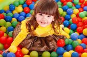 foto of orb  - Happy little girl in group colourful ball - JPG 