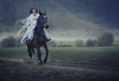 stock photo of horse  - Sensual young beauty riding a horse - JPG 