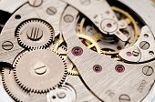 stock photo of watch  - gears and mainspring in the mechanism of a pocket watch - JPG 