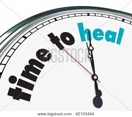 Picture or Photo of An ornate clock with the words Time to Heal on its face