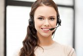foto of helpline  - friendly female helpline operator with headphones - JPG 