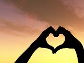 image of sky  - Concept or conceptual heart shape or symbol made of human or woman and man hand silhouette over a sky at sunset background - JPG 