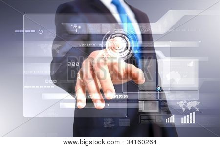 Picture or Photo of Businessman in blue suit working with digital vurtual screen