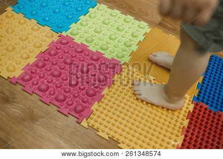 Toddler On Baby Foot Massage Mat Exercises For Legs On Orthopedic