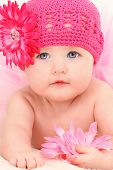 picture of infants  - Close up beautiful 4 month old american baby girl in pink flower hat and tutu - JPG 