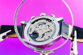 picture of watch  - Elegant watch repaired using a magnifier with three handles - JPG 