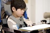 pic of cerebral  - Five year old disabled boy studying in wheelchair - JPG 