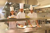foto of restaurant  - cooks in a kitchen of a restaurant - JPG 
