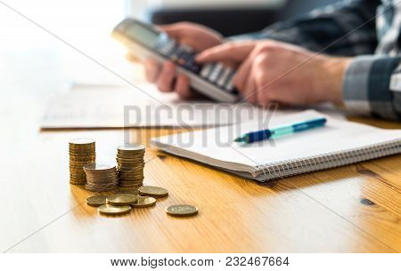 man planning family finance and using calculator counting savings budget taxes expenses and livi poster family finance budget