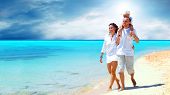 pic of beach  - View of happy young family having fun on the beach - JPG 