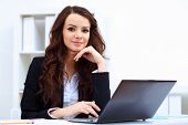 foto of notebook  - Young pretty business woman with notebook in the office - JPG 