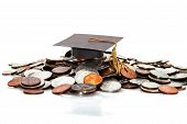 foto of money  - graduation cap on a pile of money  - JPG 