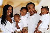 stock photo of inside  - African American family together inside their home - JPG 