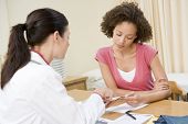 pic of medical doctors  - Woman having consultation with female gp - JPG 