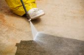 stock photo of industrial  - Maintenance worker cleaning old dirty driveway with a pressure cleaner - JPG 