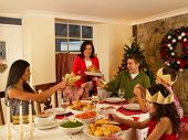 stock photo of family  - Hispanic family having Christmas dinner - JPG 