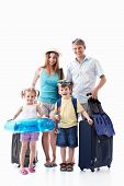 pic of family  - A happy family with their suitcases on a white background - JPG 
