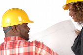 picture of construction worker  - Construction business team looking over a blueprint together - JPG 