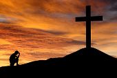 picture of religion  - Dramatic sky scenery with a mountain cross and a thinking meditating person - JPG 