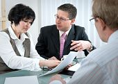 picture of meeting  - woman and her lawyer in conversation with husband during divorce process - JPG 