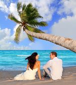 image of beach  - couple in love sitting in blue beach on vacation travel  - JPG 