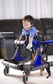 picture of cerebral  - Disabled child in walker standing up in his walker - JPG 
