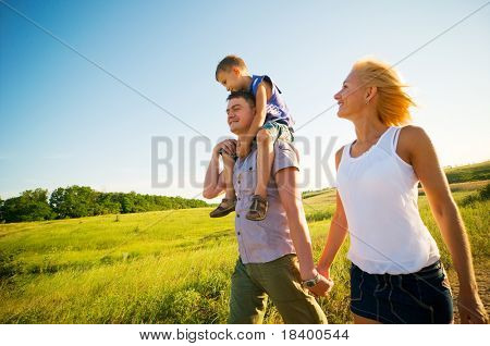 Picture or Photo of Happy family having fun outdoors