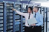image of network  - group of young business people it engineer in network server room solving problems and give help and support - JPG 