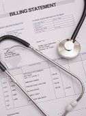 picture of medical  - Stethoscope on medical billing statement all text is anonymous - JPG 