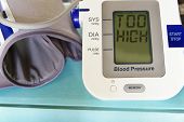 foto of pressure  - Blood pressure arm band with Too High text - JPG 