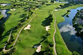 stock photo of golf  - aerial view of manicured golf course in florida - JPG 