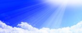 stock photo of blue sky  - Clouds with blue sky and bright sunny rays - JPG 