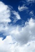 stock photo of blue sky  - Dramatic clouds over deep blue sky background - JPG 