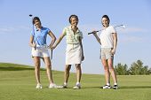 image of golf  - Portrait of three women on golf course - JPG 