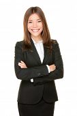 foto of confident  - Asian business woman smiling happy portrait in black suit standing proud and confident with arms crossed isolated on white background - JPG 