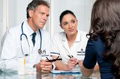 picture of medical doctors  - Young female patient discuss with doctors on her medical exam at hospital - JPG 